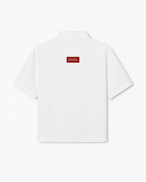 white dobbel shirt with polo and creating stories to tell my grandchildren label