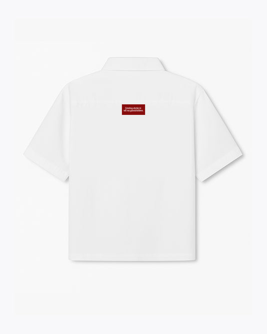 white dobbel shirt with polo and creating stories to tell my grandchildren label